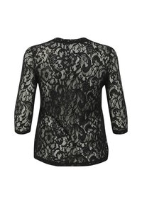 Top en dentelle noire avec un motif floral, manches trois-quarts et col rond. Le tissu présente une texture délicate et translucide.