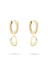Orecchini in tono oro caratterizzati da un design ad anello con un pendente triangolare. Texture liscia con forme minimaliste e contemporanee.