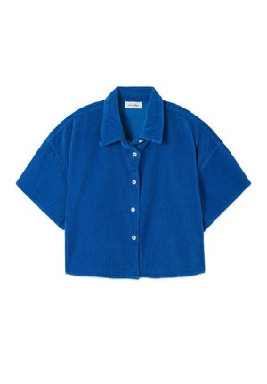 Srajca z kratkimi rokavi in gumbi, izdelana iz živahnega modrega kordurovega blaga. Ima ravni ovratnik in kvadratno, skrajšano silhueto z rebrasto teksturo.