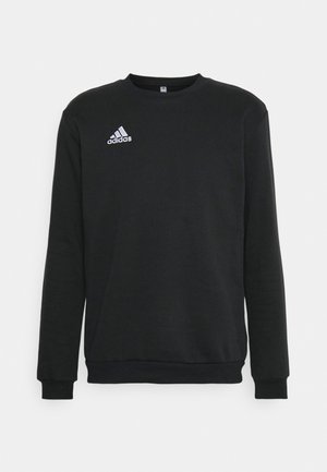 Sweatshirt preto feito de tecido suave, com decote redondo e mangas longas. Destaca-se o logo da Adidas em branco no lado esquerdo do peito.