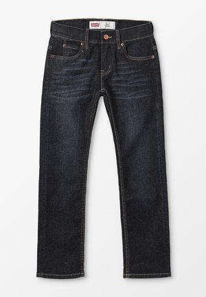 Tmavě modré úzké džíny Levi's s předními kapsami, měděnými nýty, zapínáním na knoflíky a viditelnými švy.