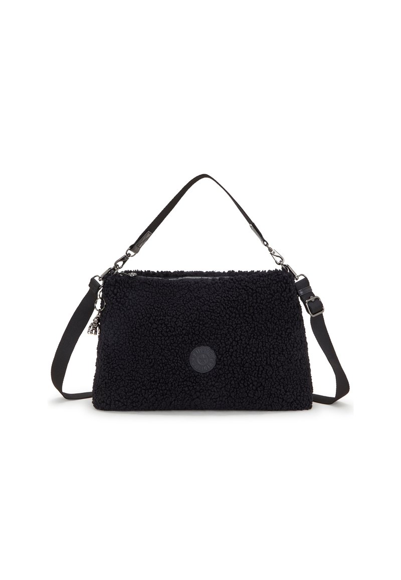 Black fur-textured handbag with adjustable shoulder strap and zip closure. Features a logo patch and a small charm attached. Rectangular shape.