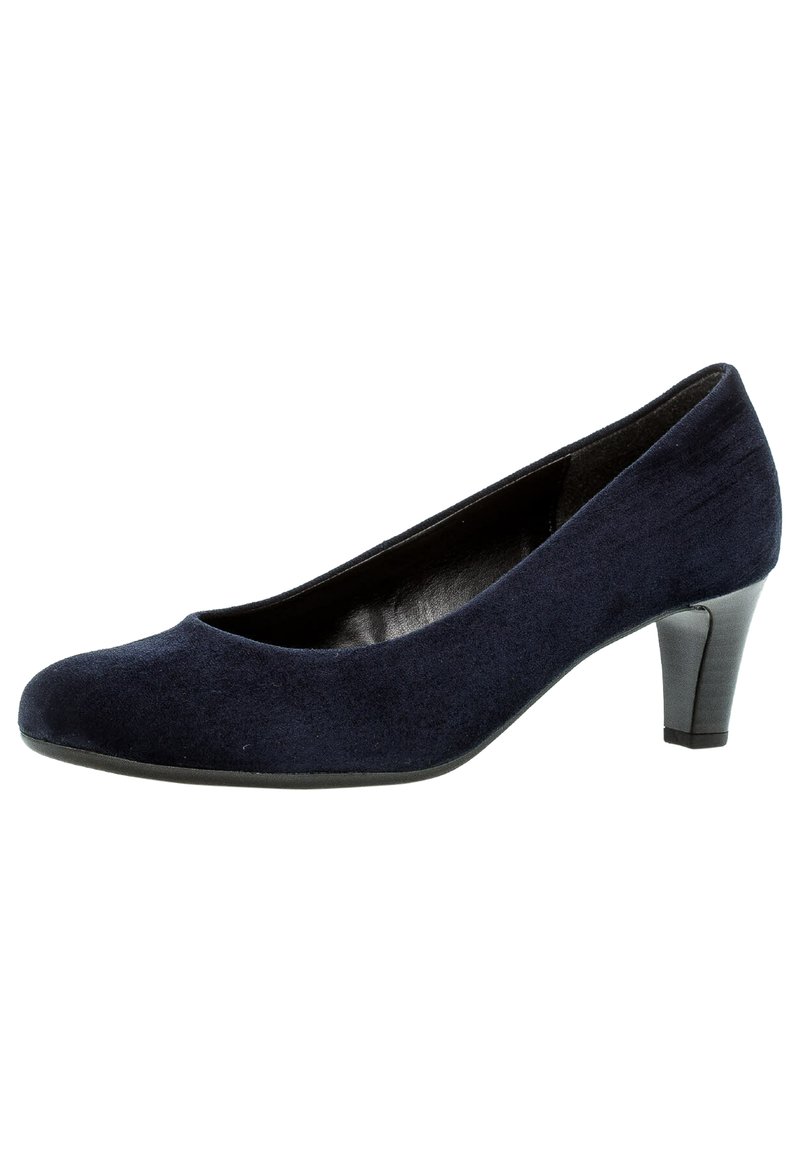 Escarpin en suede bleu marine avec un bout arrondi et un talon bloc de hauteur intermédiaire. L'intérieur est doté d'une doublure noire. Texture lisse, design simple.