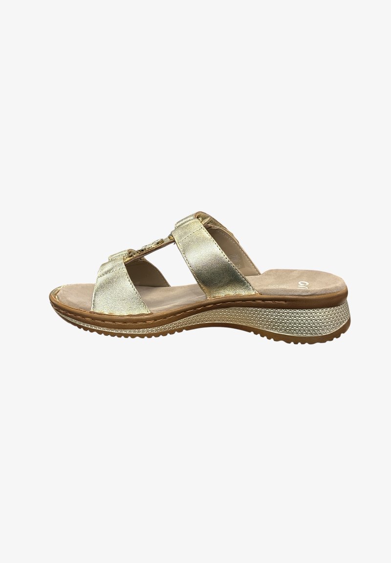 Gold metallic sandals with two adjustable straps, beige cushioned insole, and a textured white outsole. Features a low wedge heel.