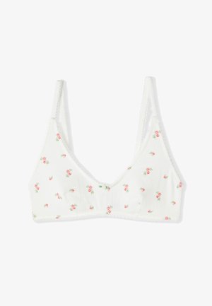 Soutien-gorge blanc à coque souple avec bretelles ajustables et petit motif floral de roses roses, orné d'un minuscule nœud au centre devant.