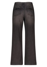 Zwarte wijde jeans met twee achterzakken, een rits en een vervaagde denimtextuur. Gelijkmatig gesneden met een losse, relaxte pasvorm.
