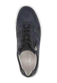 Dark blue suede sneaker with laces and side zipper. White rubber sole, padded collar, and silver logo on the insole. Rounded toe design.