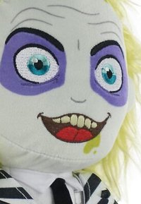 Plush puppet featuring a gray face, large blue eyes, purple accents, black eyebrows, yellow hair, a black-and-white striped suit, and a toothy grin.
