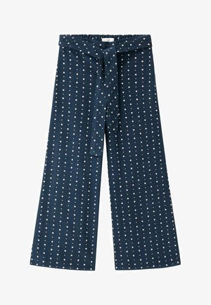Pantalons large en tissu bleu marine, dotés d'une surface texturée avec des pois blancs. Ceinture réglable avec lien, devant plat et dos élastique.