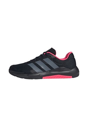 Black athletic shoe with three gray stripes, pink inner lining, and pink tread detail on the sole, viewed from the side.
