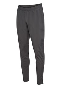 Grijze sportbroek met een elastische tailleband, taps toelopende pijpen en ritsen bij de enkel. Gemaakt van lichtgewicht, soepel materiaal.