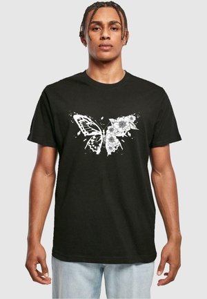 Black cotton t-shirt featuring a white butterfly and floral graphic design on the front. Short sleeves and a crew neckline.