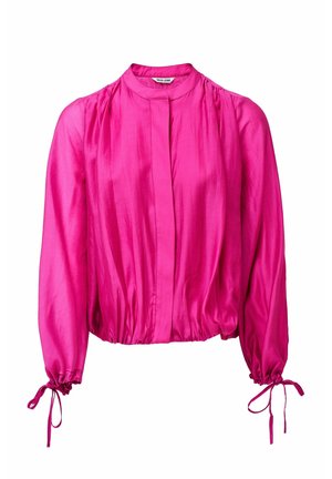 Blusa rosa brillante a maniche lunghe con polsini arricciati legati con fiocchi, colletto alto e orlo in vita morbido e arricciato.