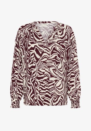 Langsleeve top in bordeaux en crème met een zebra-patroon. Heeft een V-hals en gathered mouwen. Gemaakt van zachte, lichte stof.