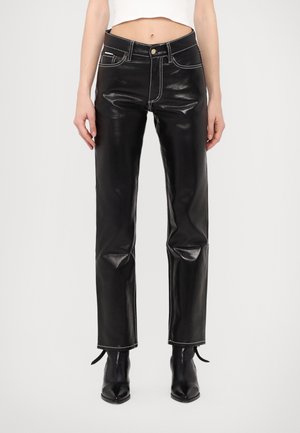 Black leather pants with a shiny finish, featuring contrast white stitching, front pockets, and a straight-leg cut.