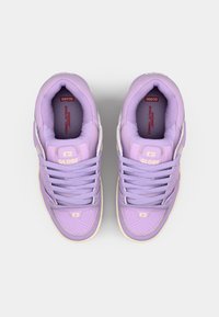 Purple sneakers with a smooth leather upper, perforated toe box, and padded tongue. Features flat laces and a contrasting cream outsole.