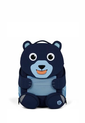 Children’s navy blue and light blue backpack designed as a smiling bear with ears, eyes, nose, paws, and two zippered compartments.