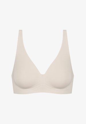 Lichtbeige beha met een naadloos, soepel ontwerp. Voorzien van brede banden, een v-halsvorm en geen zichtbare bevestigingen of decoratieve elementen.