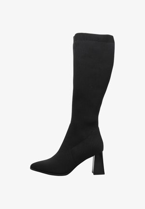 Botte en maille noire haute, avec bout pointu et talon haut carré.