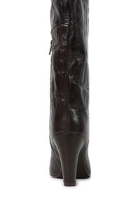 Brown leather knee-high boot with a textured finish, pointed toe, and a medium heel. Side zipper for easy wear.