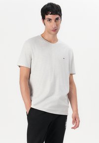 Tommy Jeans SLIM FLAG - Tepláky - black