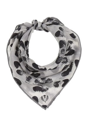 Écharpe triangulaire grise avec des taches abstraites noires et un petit logo floral près de l'extrémité pointue, nouée en un nœud lâche.
