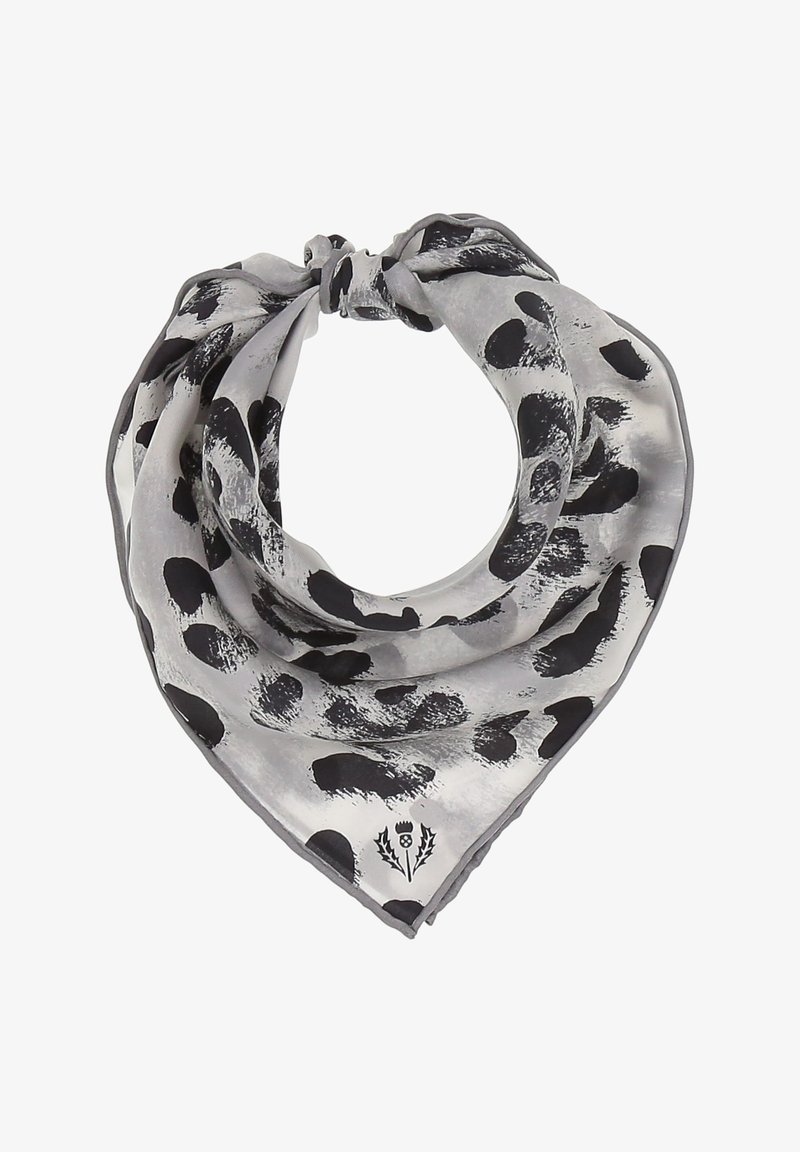 Écharpe triangulaire grise avec des taches abstraites noires et un petit logo floral près de l'extrémité pointue, nouée en un nœud lâche.