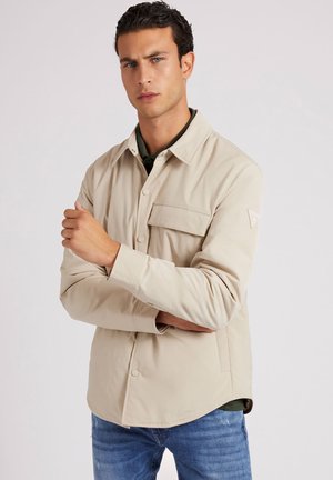 Halflange jas - beige