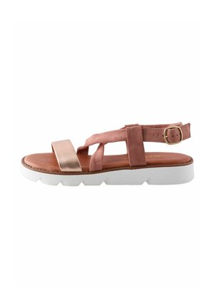 Sandaler med övre del i rosa mocka, metalliskt gyllene rem och vit gummisula med ett zickzackmönster. Justerbar spänne vid vristen för perfekt passform.