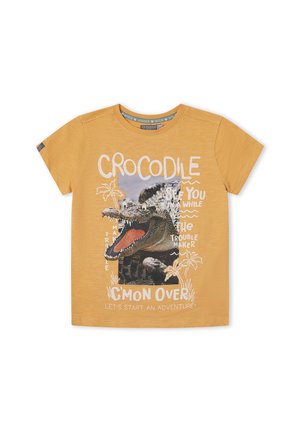 Camiseta amarilla de manga corta para niños con un gráfico de un cocodrilo con la boca abierta y texto: "Cocodrilo, nos vemos en un rato, alborotador, ven acá."