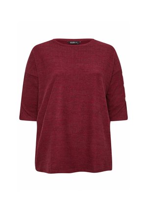 Burgundy, lyhythihainen paita pehmeästä, teksturoidusta kankaasta, jossa on väljä istuvuus ja kolme koristepainiketta jokaisessa hihassa. Pyöreä kaula-aukko.