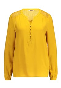 Blusa gialla a maniche lunghe con scollatura a V, dettagli con bottoni e pannelli sulle spalle testurizzati. Realizzata in tessuto morbido con una vestibilità regolare.