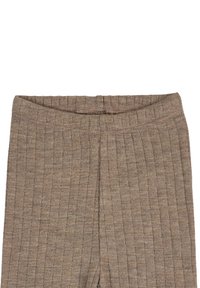 Beige ribbed leggings with an elastic waistband. Textured fabric features vertical lines and a fitted design. No pockets or embellishments.