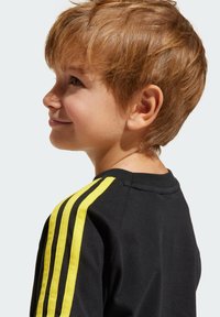 adidas Originals SMILEY WORLD KIDS - T-shirt med print - black