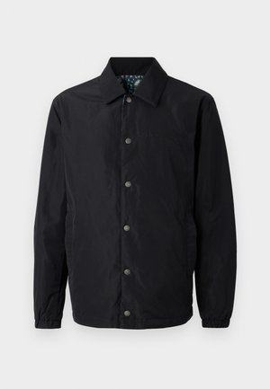 Black jacket made of lightweight fabric, featuring a pointed collar, snap front closure, elasticized cuffs, and a patterned inner lining.