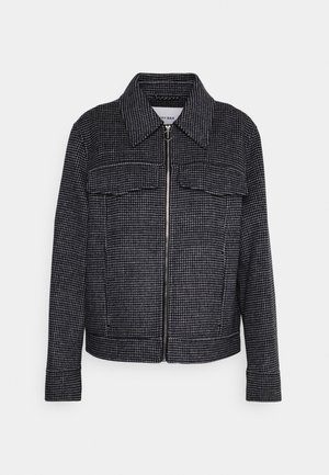 Zwart-wit houndstooth-patroon jacket met een rits aan de voorkant, kraag en twee borstzakken, met een gestructureerde pasvorm.