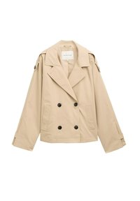 Beige Doppelreiherjacke mit großen schwarzen Knöpfen, breiten Revers und geknöpften Schulterepauletten. Glattes, leichtes Material, entspannte Passform.