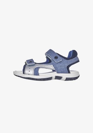 Sandalo in stile denim blu con suola bianca, cinturini regolabili e dettagli in rete. Design aperto con una suola testurizzata e flessibile per il comfort.