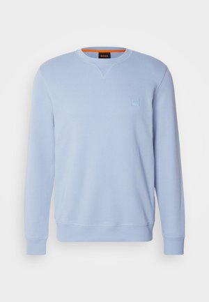 Svetlomodrý mikina vyrobená z bavlneného zmesi, s okrúhlym výstrihom, dlhými rukávmi a malým embosovaným logom na hrudi.