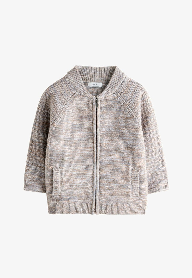 Cardigan beige en maille avec fermeture éclair, col, poignets et ourlet côtelés, deux poches avant et manches raglan longues.