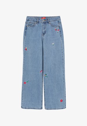 Light blue wide-leg jeans made of denim, featuring floral embroidery in red, green, and yellow accents, with a zip fly and front pockets.
