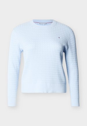 Light blue cable knit long-sleeve sweater with crew neck and small embroidered logo on the left chest.