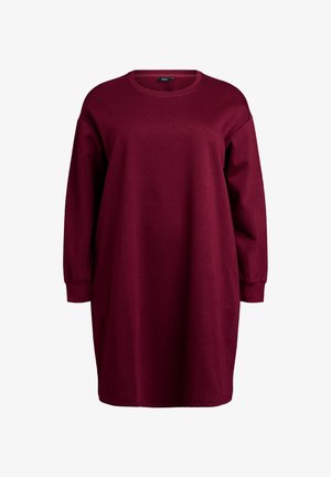 Burgundia ülevõetud sviitermekko pikkade varrukatega, ümar kaelus ja pehme tekstuur, millel on mugav lõige ja minimaalne detail.