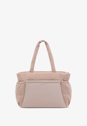 Soft pink ribbed fabric tote bag with padded handles and a smooth front pocket labeled "Kapten & Son."