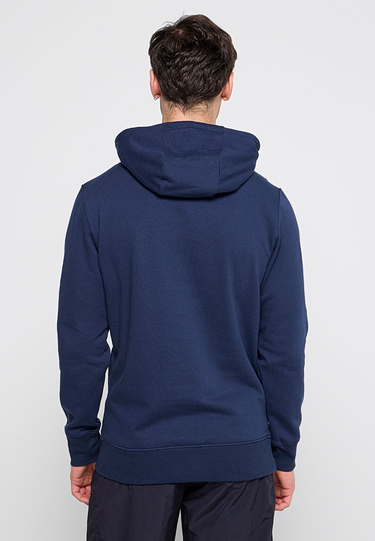 Marineblauer Kapuzenpullover mit einer gemütlichen Textur, taillierter Silhouette und geripptem Saum. Verfügt über eine Kapuze und lange Ärmel, ohne sichtbare Logos.