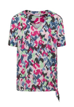 Haut à manches courtes avec col en V, motif abstrait multicolore rose, bleu, vert, noir et blanc et détail noué sur le côté.