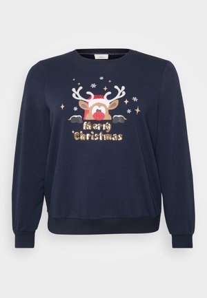 Sweatshirt bleu marine avec un motif de renne portant un nez rouge et un chapeau de No�ël, accentué de sequins dorés et de motifs de flocons de neige blancs.