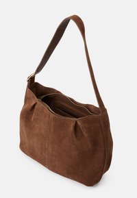 Brown suede shoulder bag with a soft texture, zip closure, and leather strap. Features side pleats and an interior pocket.