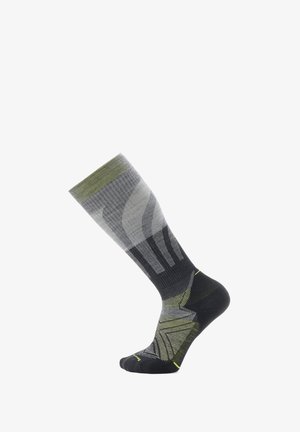 Calcetines hasta la rodilla con un patrón degradado en gris y verde, con un talón y punta negros. Tejido texturizado con acentos geométricos.