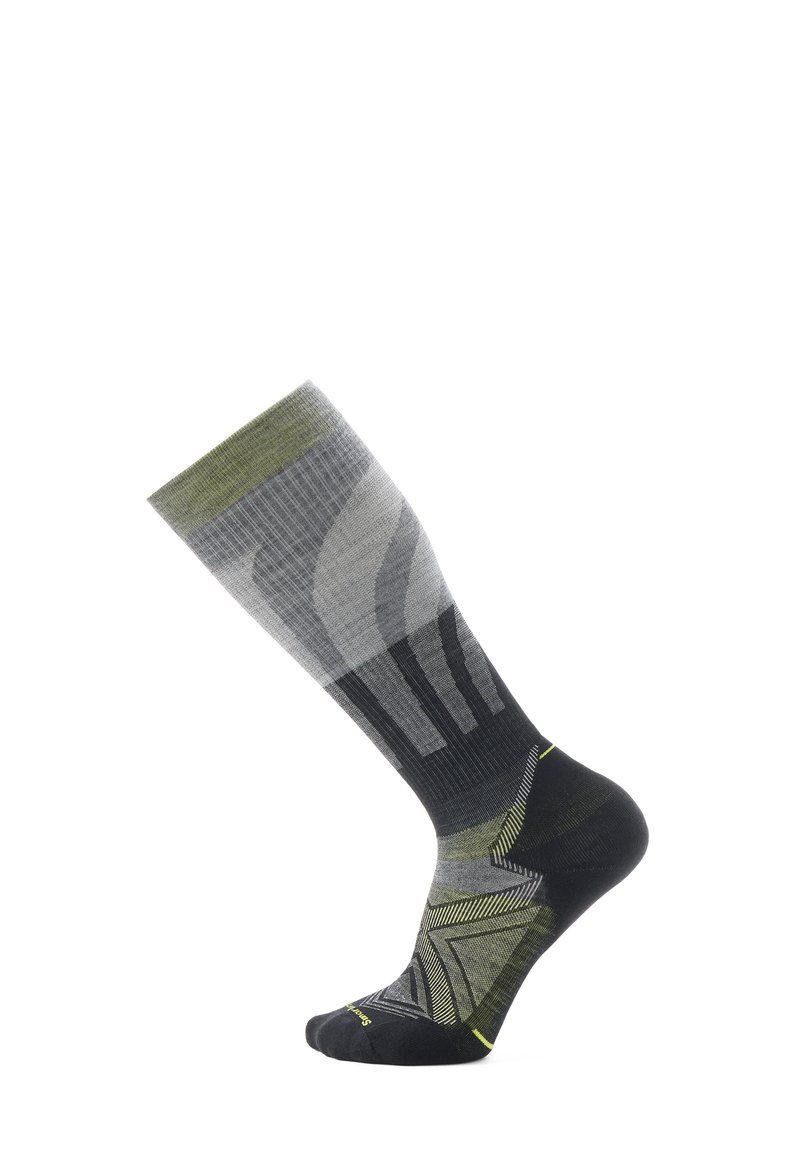 Calcetines hasta la rodilla con un patrón degradado en gris y verde, con un talón y punta negros. Tejido texturizado con acentos geométricos.